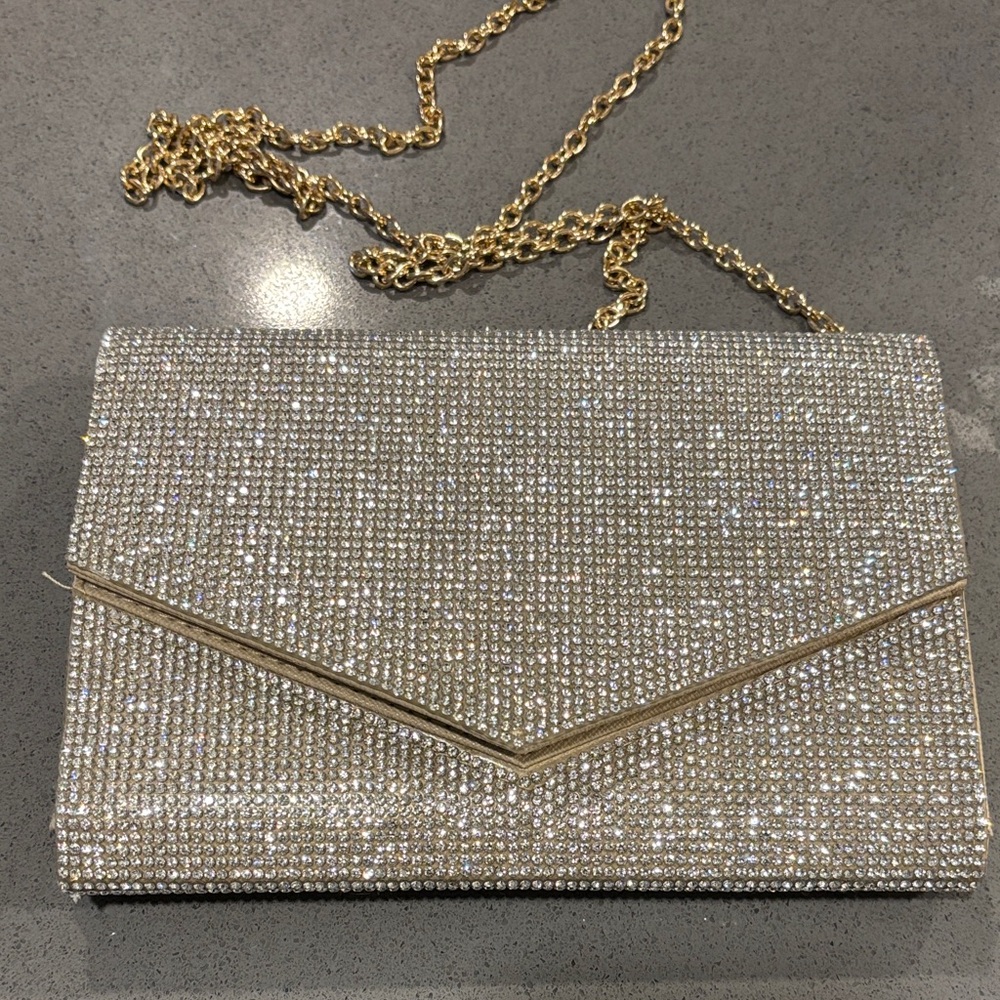 Elegant Silver Clutch with Gold Chain